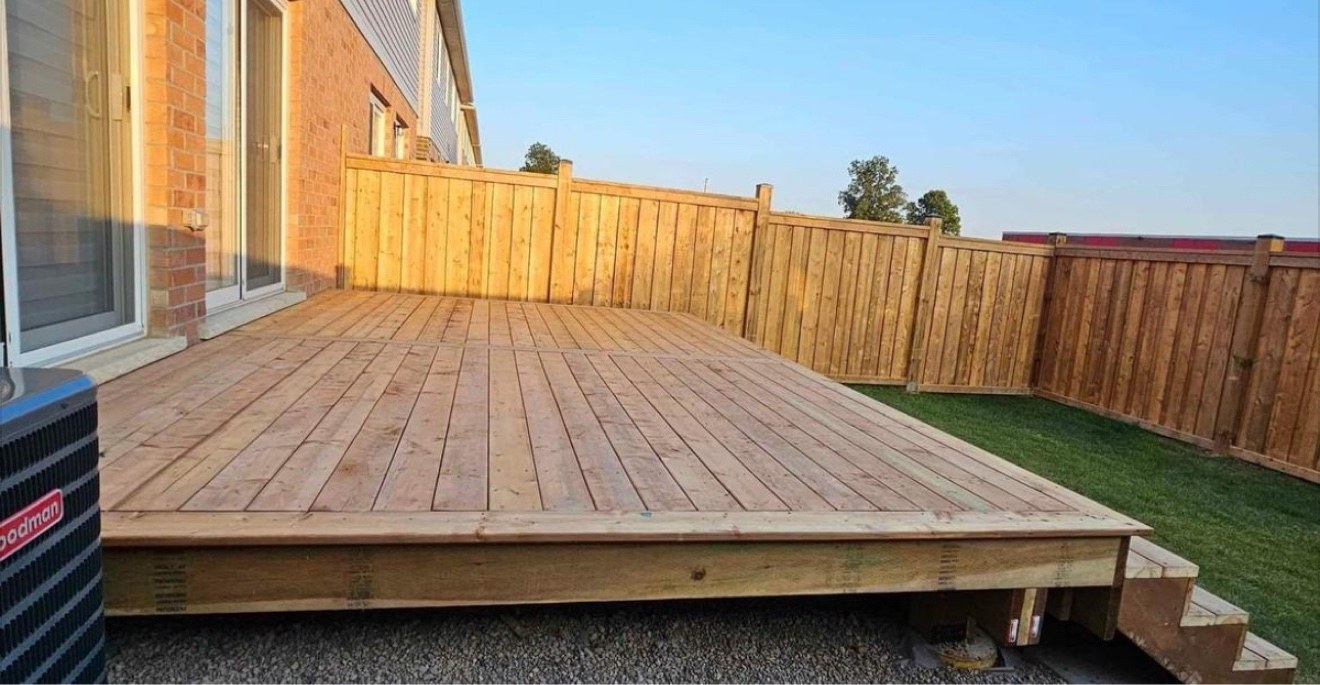 New deck in a fenced backyard