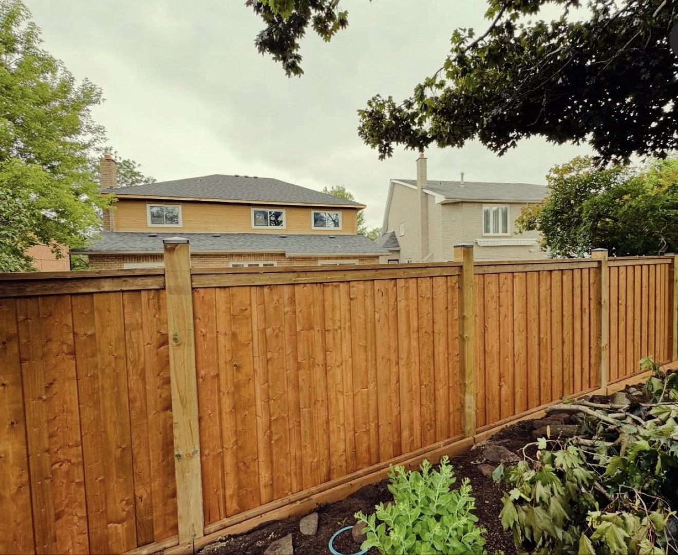 Long full privacy fence with top cap rails